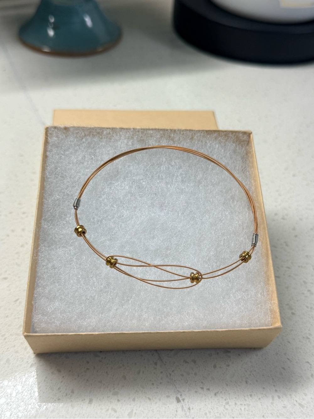 Delicate Gold-Tone Wire Bangle Bracelet with Bead Accents